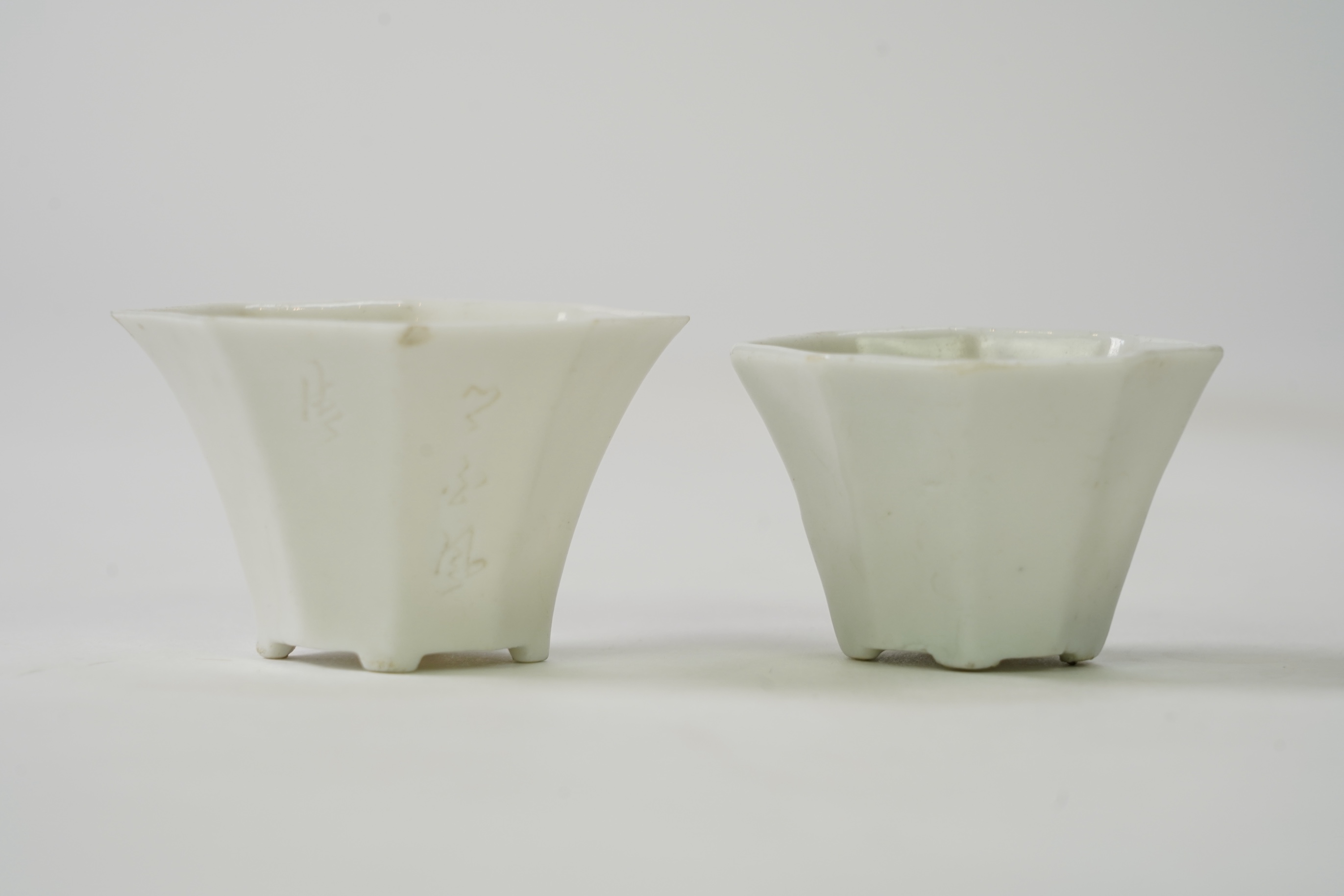 Two Chinese Dehua blanc de chine octagonal cups, Kangxi period